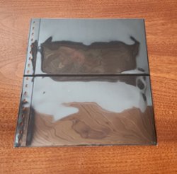 2 pocket black two sided pages for the Lindner 18 ring binders; used but in good condition; winning bidder can buy up to 14 at the high bid; very hard to photograph!!