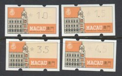 A group of four vending machine stamps with different face values