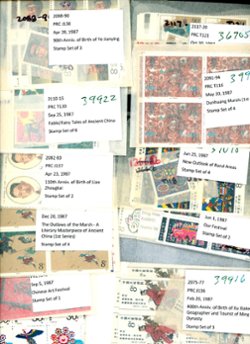 A dealers stock of 1987 in multiples of four or more in well labeled glassines. A few used are also included. See the second image for a detailed list of what is included. (2 images)