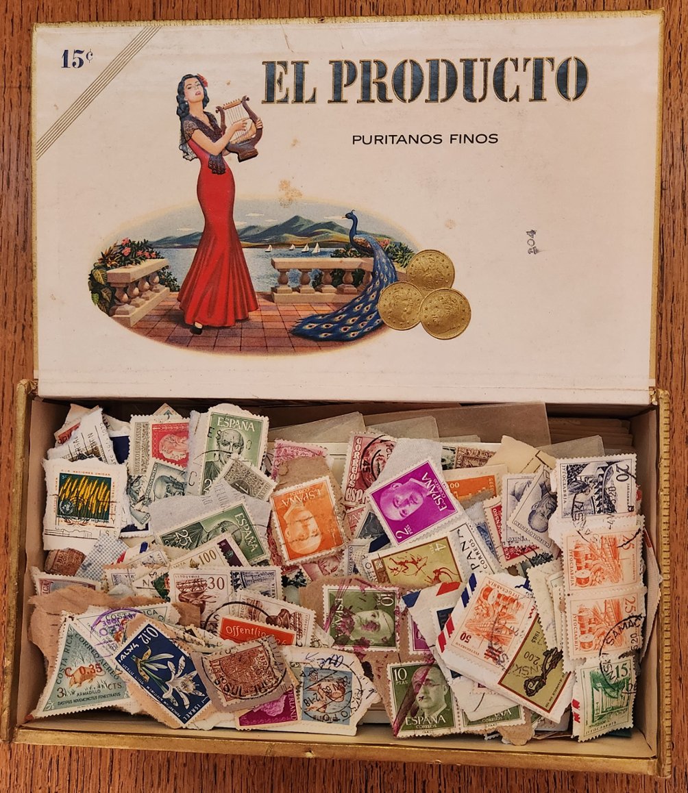 An old time cigar box filled with about 1,000 Foreign and U.S. stamps (will be shipped without the box to save postage)